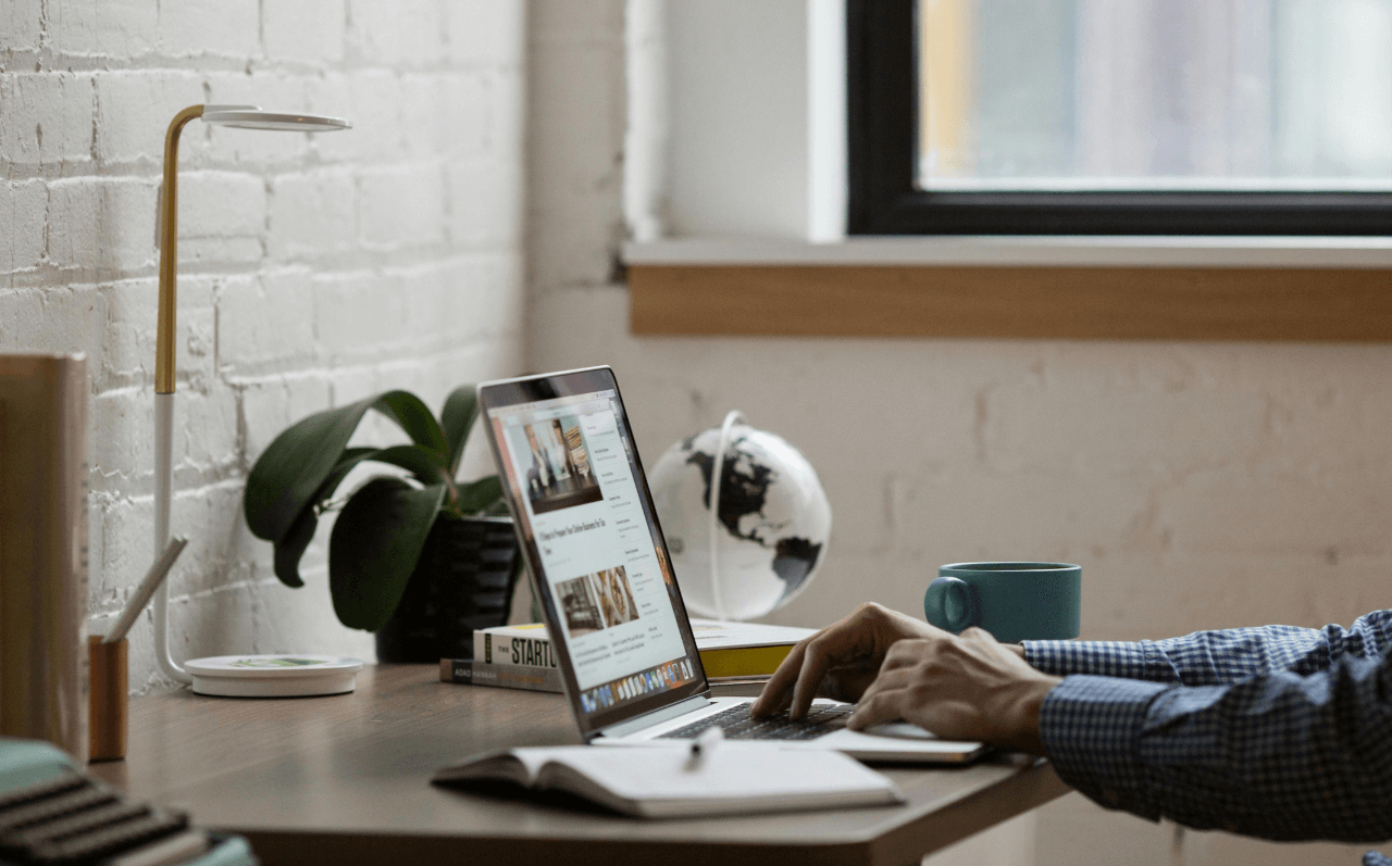 Person reading an article on a laptop